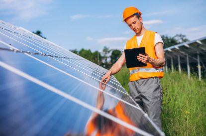 man-worker-firld-by-solar-panels-1-1